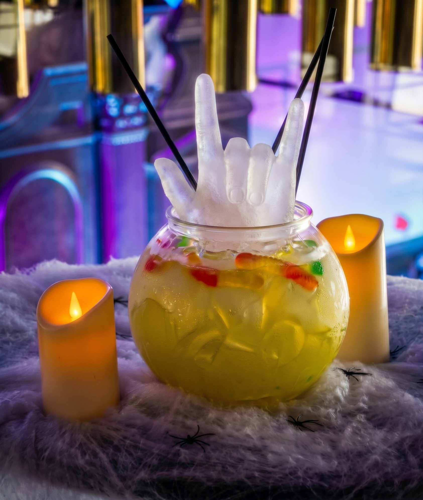 Radioactive Sharer served in a bowl with gummy worms and frozen ice hands